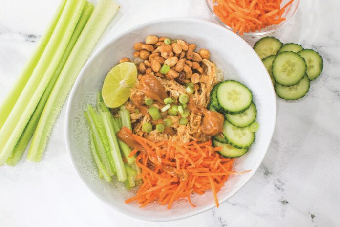 Make a savory chicken and rice bowl with carrots, peanuts and cucumbers this spring.