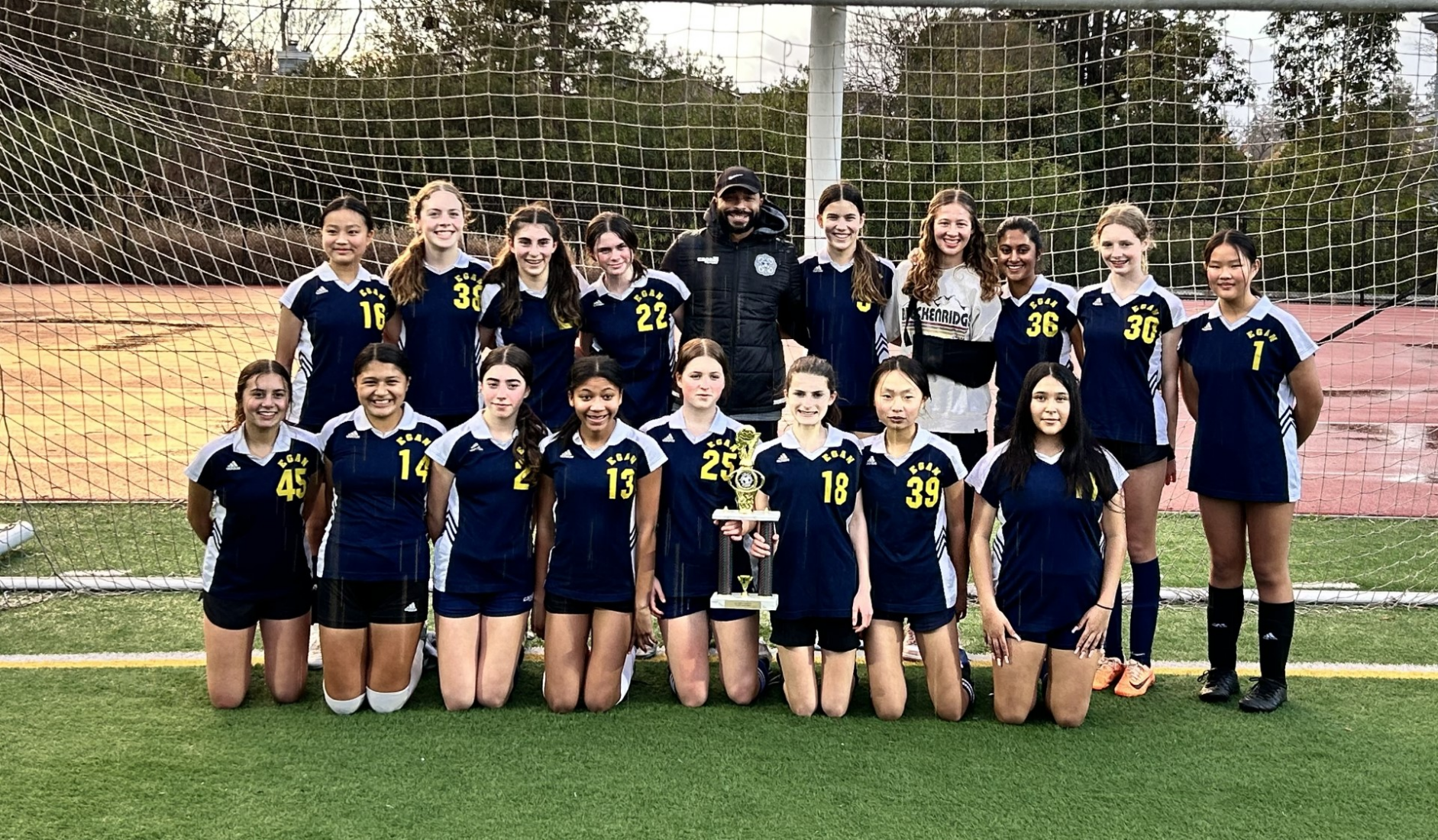 The eighth grade Egan soccer team. Top row: (left to right) Fiona Shi, Bree Van Wert, Lia Amirbekian, Dylan Harrison, Coach Ricky Character, Anneliese Braun, Ava Belton, Shreya Sampat, Josie Sonora, Maddie Louie. Bottom row: Emma Middleton, Fernanda Mendieta, Maya Meltz, Ana Asmar, Charlotte Wolfe, Eliana Witteles, Elly Song, Janae Delgado.