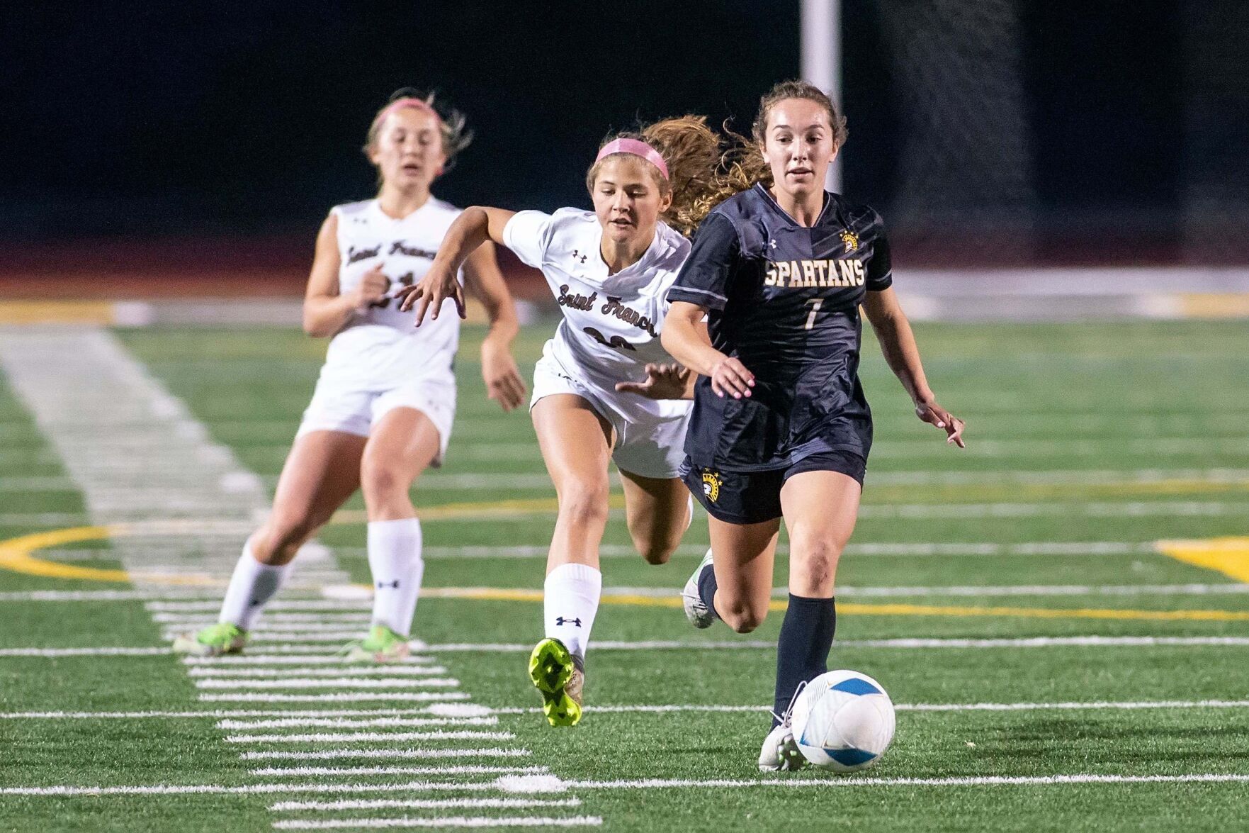 Mountain View High’s Allie Montoya races toward the goal, pursued by two St. Francis players in Friday's CCS Open Division final. The senior scored two goals in the Spartans' 3-1 victory.