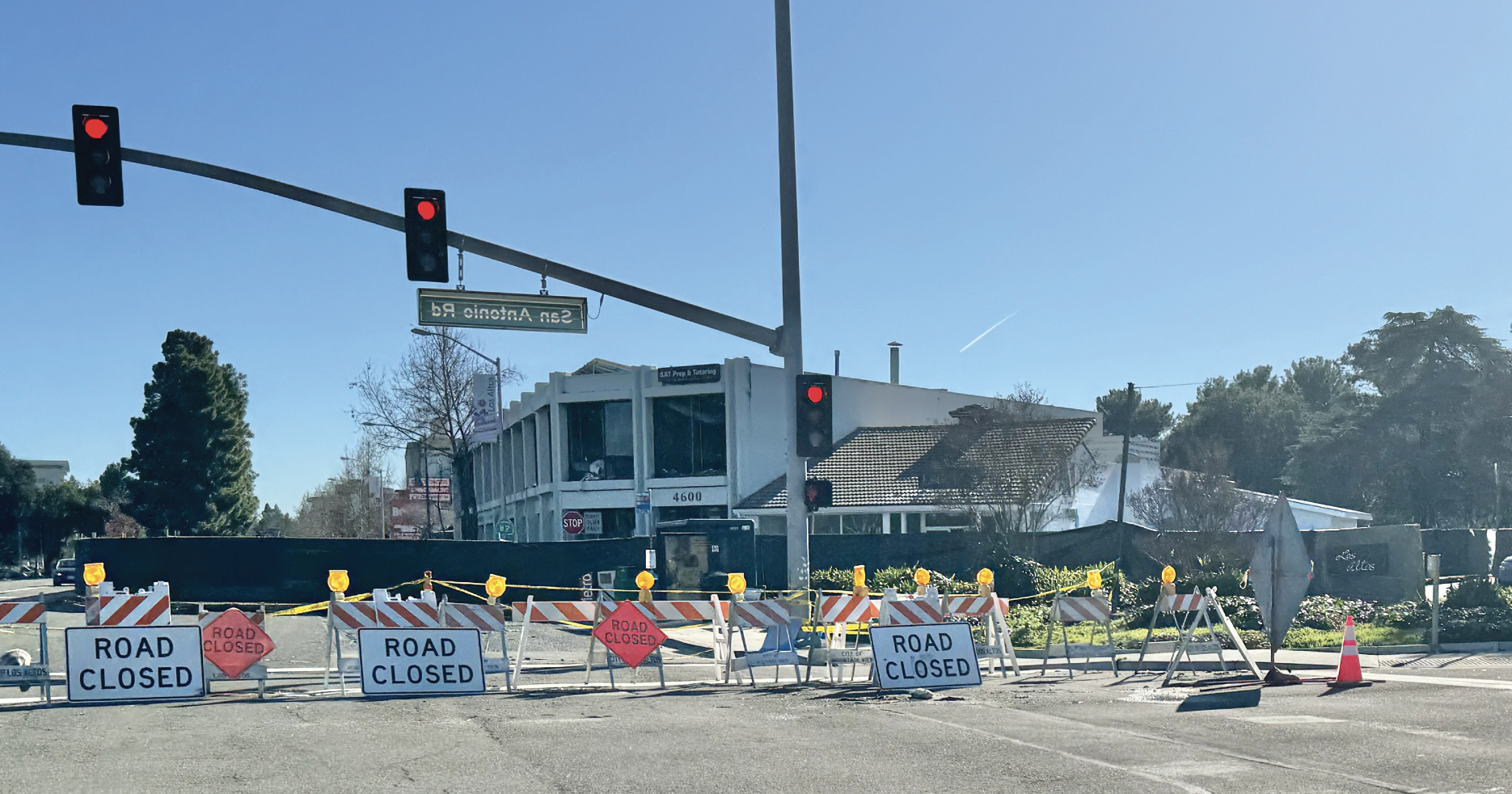 A usually busy corner of San Antonio Road and El Camino Real remains closed to traffic as crews prepare for demolition of the fire-ravaged building at 4600 El Camino Real.