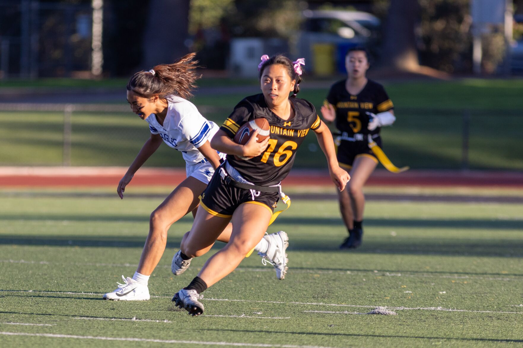 Mountain View running back Megan Pan carries the ball during the game against Los Altos Wednesday. The Spartans would claim the rivalry victory over the Eagles 25-18.