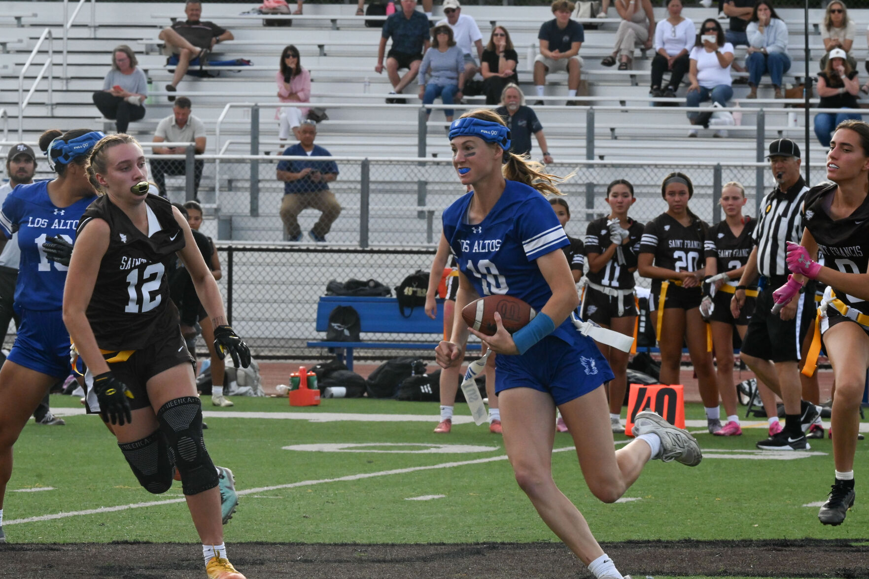 Los Altos quarterback Sabrina Neal runs for yardage during the game Sept. 17 against St. Francis. The Eagles won 7-0.
