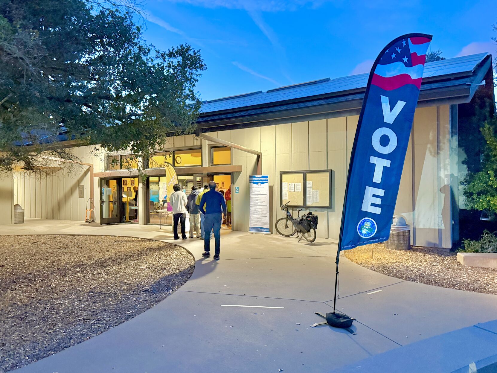 Community members line up to cast their votes at the Los Altos Hills town hall Tuesday night.
