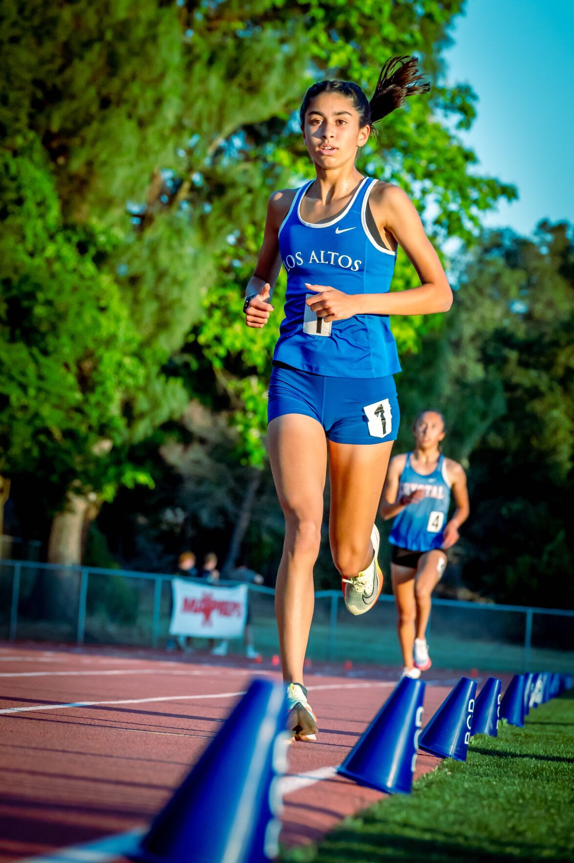 Los Altos High’s Lauren Soobrian leads the way in the 3,200 run Saturday at the CCS finals in Gilroy. The junior won the race, breaking her own school record in the process.