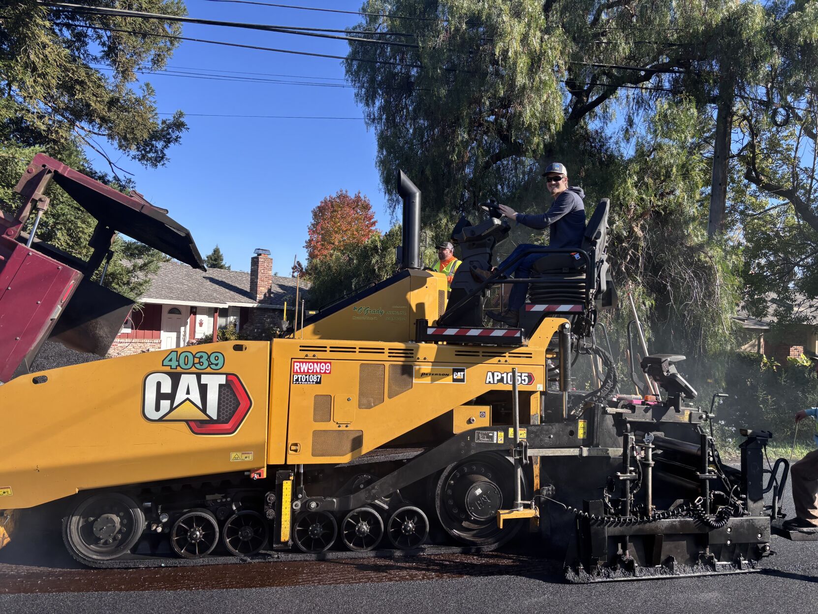 Evan Smith, 17, riding the O’Grady Paving paver. Evan has been coming out to job sites since he was six years old and riding on different pieces of equipment.