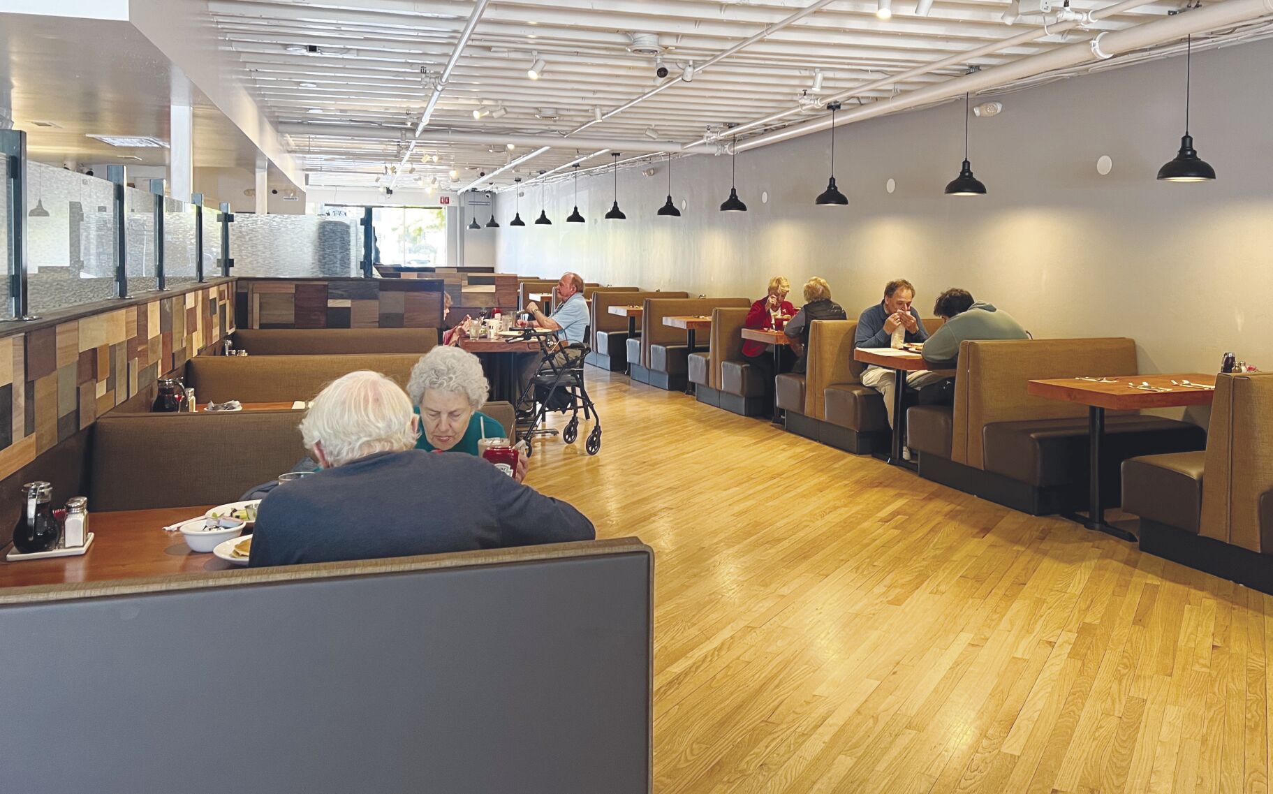 Customers dine at Holder’s Country Inn restaurant last week. The eatery opened May 27 in downtown Los Altos for breakfast, lunch and dinner, and the bare walls will soon be lined with art from local artists.