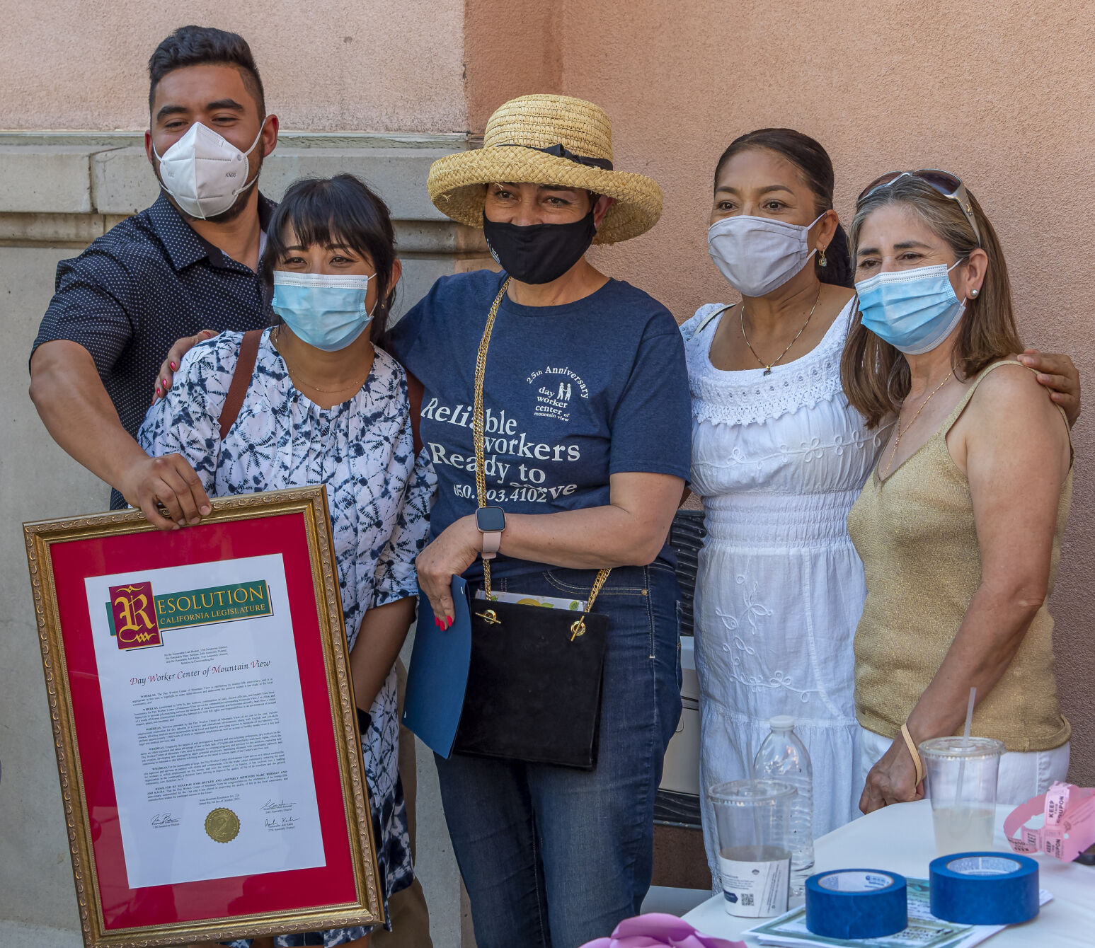 Day Worker Center of Mountain View supporters, led by executive director Maria Marroquin, center, celebrate the nonprofit’s 25th anniversary last month at the Mountain View Civic Center.