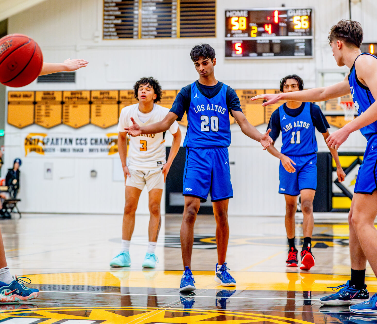 Los Altos guard Manu Shankar gets congratulated after hitting the first of his three free throws in the fourth quarter of Tuesday’s win against Mountain View.