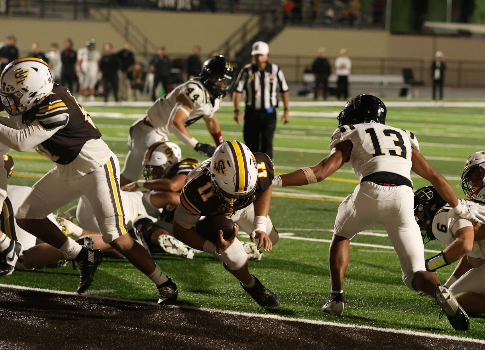 St. Francis running back Motu Keanaaina scores the game-winning touchdown against Archbishop Mitty Friday to win 20-19.
