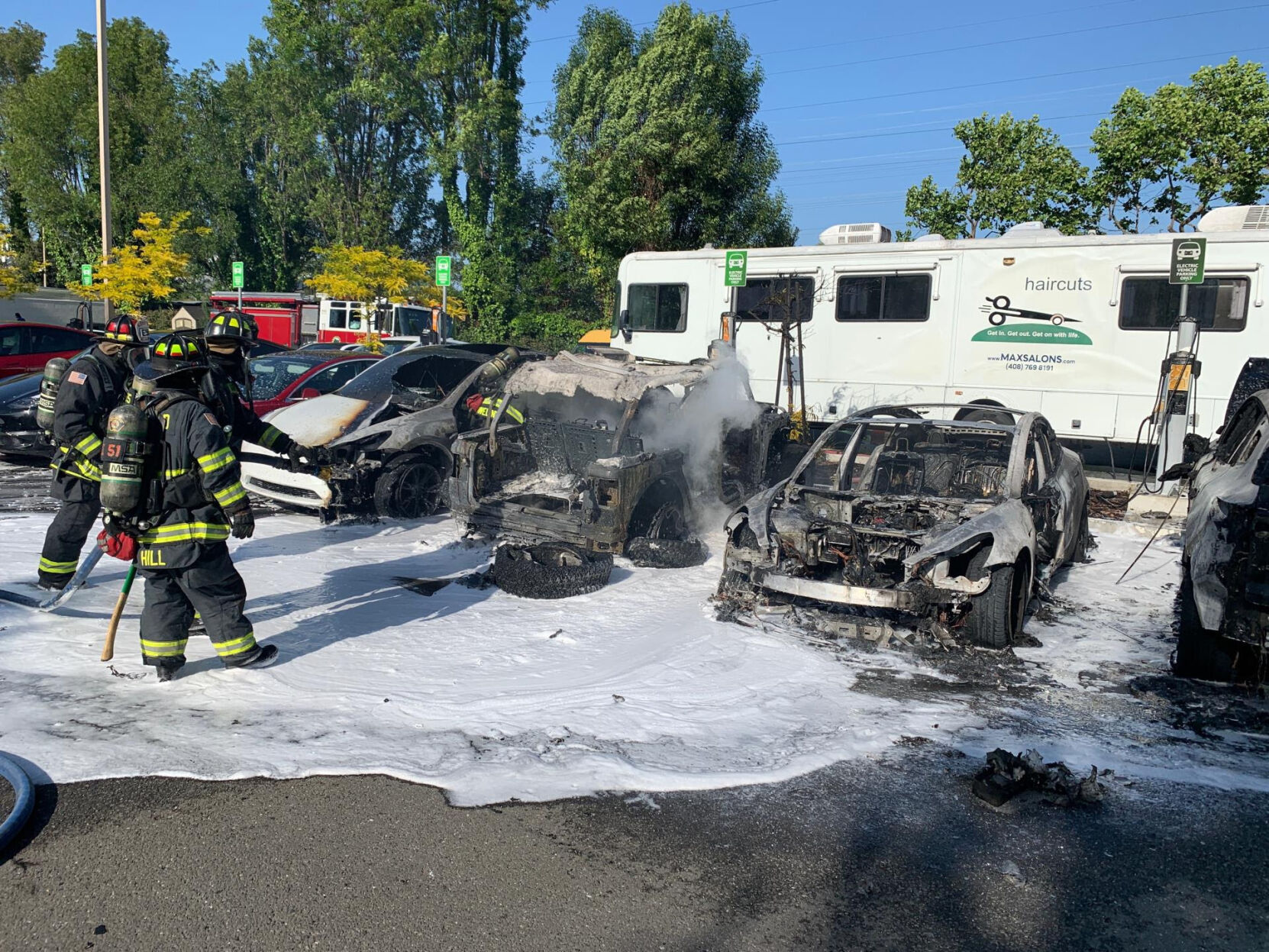 Firefighters put out a lithium-ion-induced fire in a commercial office building parking lot.