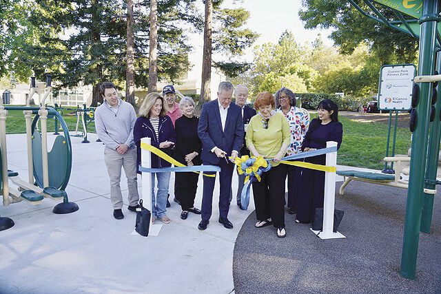 Members of Mountain View City Council and El Camino Healthcare District officials celebrate the opening of a new “fitness cluster” at Cuesta Park.