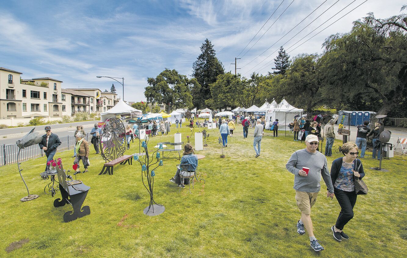 Visitors enjoy the festivities at Fine Art in the Park in this scene from 2018.