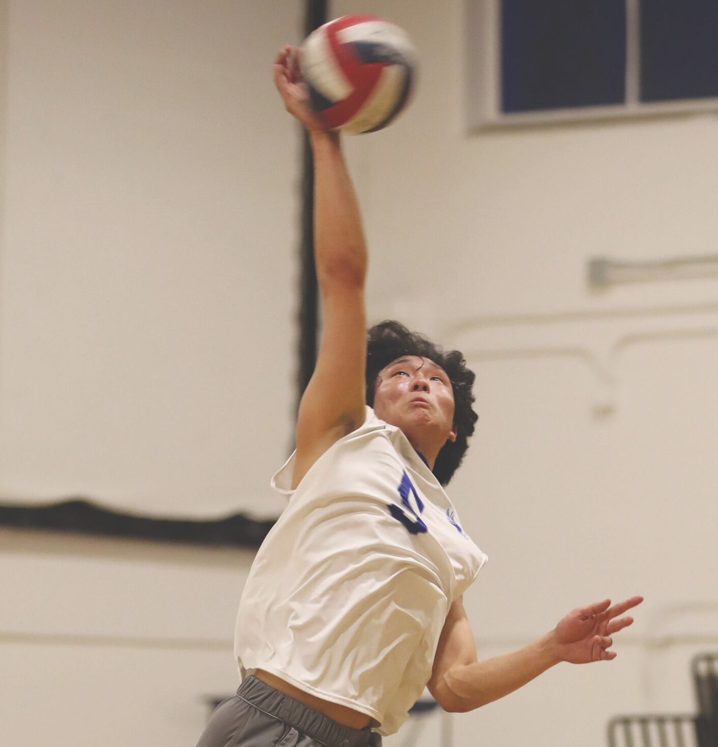 Los Altos High senior setter Ethan Choe goes for a kill in Friday’s match against Los Gatos. The Eagles prevailed in four sets.