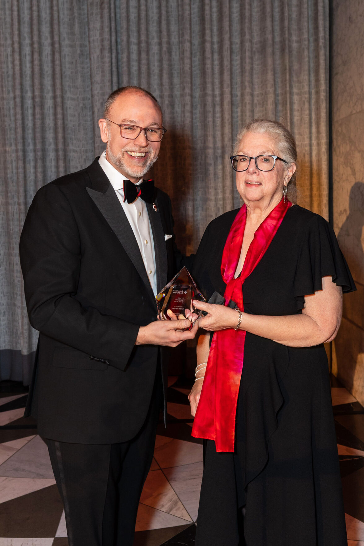Linda Dotson of Los Altos receives the Northern California 2025 Red Cross Visionary Partner of the Year Award from Trevor Riggen, the nonprofit’s president of Humanitarian Services, at the 30th Anniversary Red Cross Gala March 22 in San Francisco.
