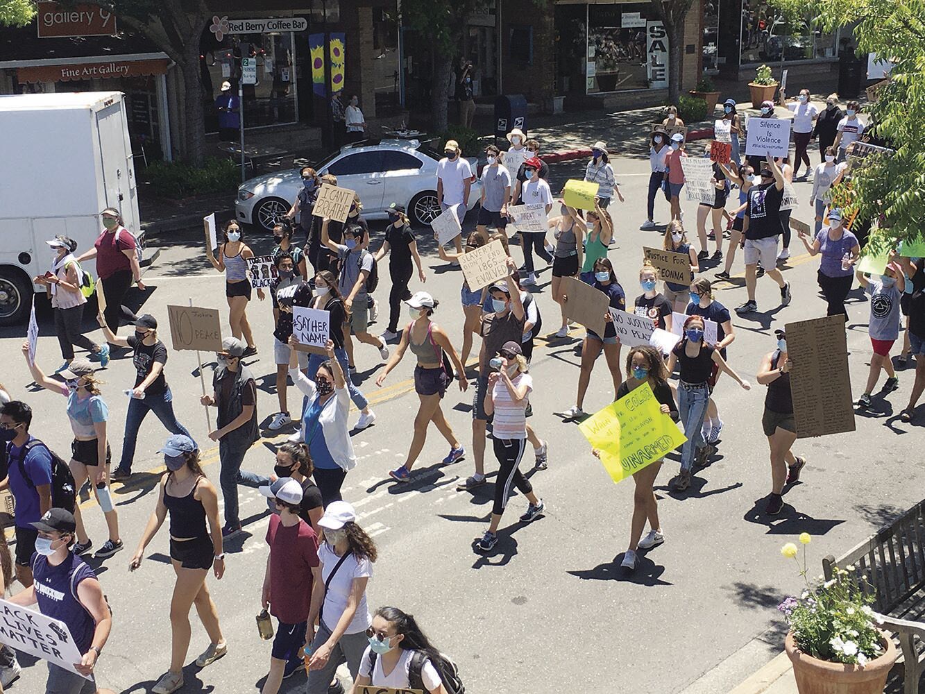 Protesters march down Main Street in downtown Los Altos in June 2020. Reactions to the killing of George Floyd at the hands of police sparked protests nationwide and prompted police reform efforts, including one in Los Altos.