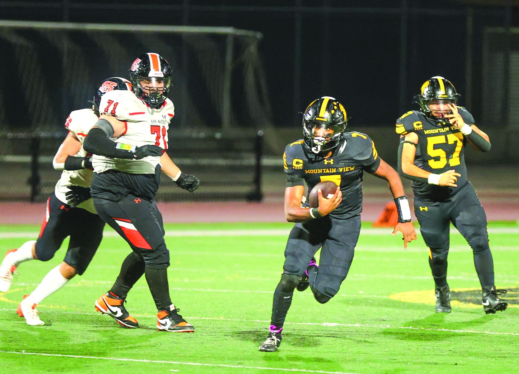 Mountain View quarterback Ishan Devarapalli scrambles for yardage against San Mateo Thursday in a 35-21 loss.