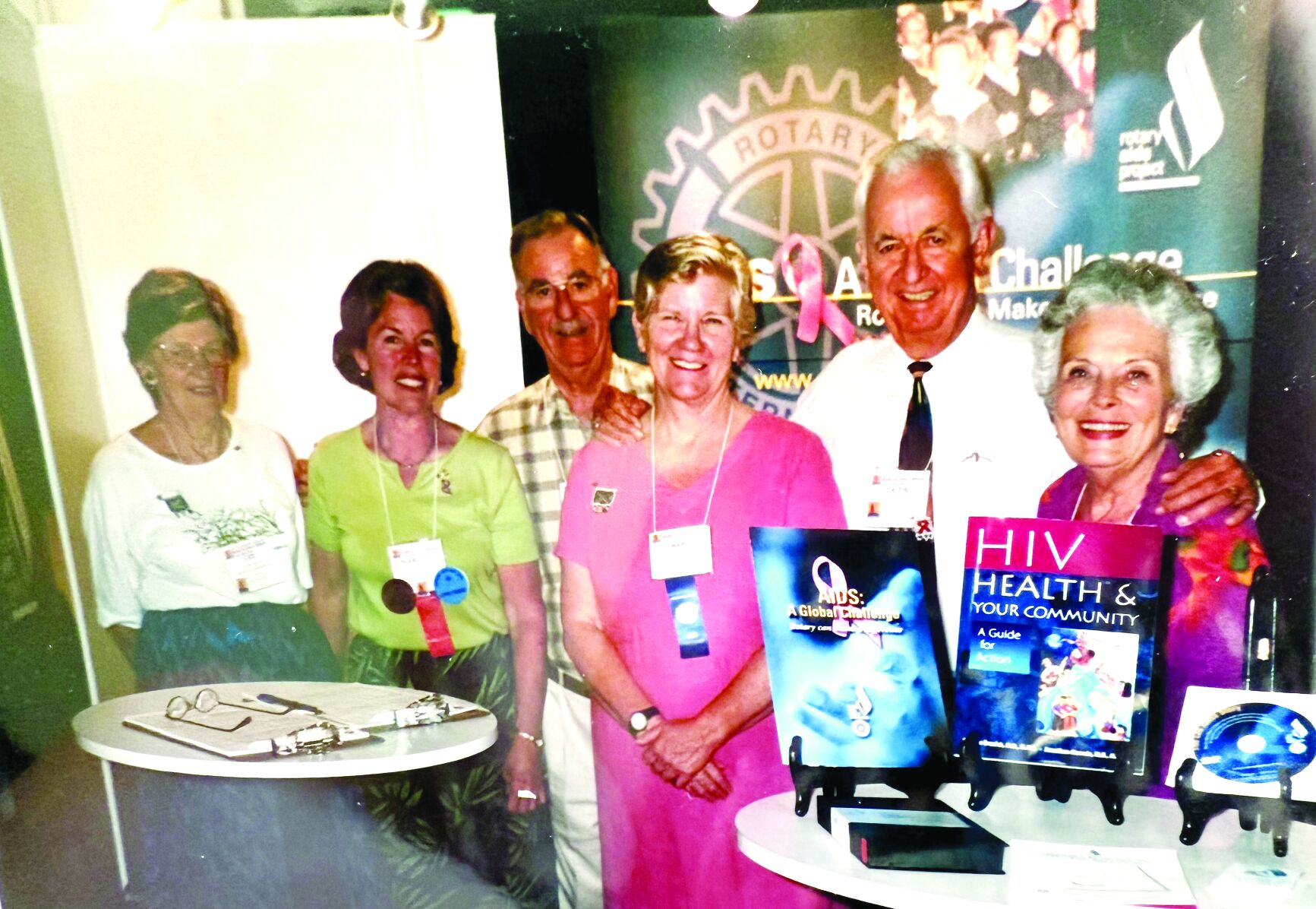Los Altos Rotary AIDS Project booth at 2002 Rotary International Convention in Barcelona. Pictured above, from left are Lee Lynch, Marlene Cowan, B.J. Styles, president of the National AIDS Coalition, Mary Prochnow, Dude and Barbara Angius.