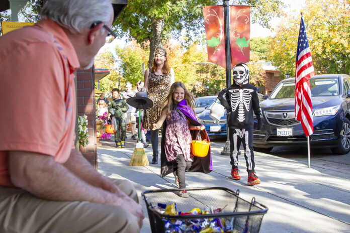 Megan V. Winslow/Town CrierChildren race toward a bowl of treats during a past Halloween Spooktacular in downtown Los Altos. This year’s event is scheduled for noon to 4 p.m. Oct. 31.