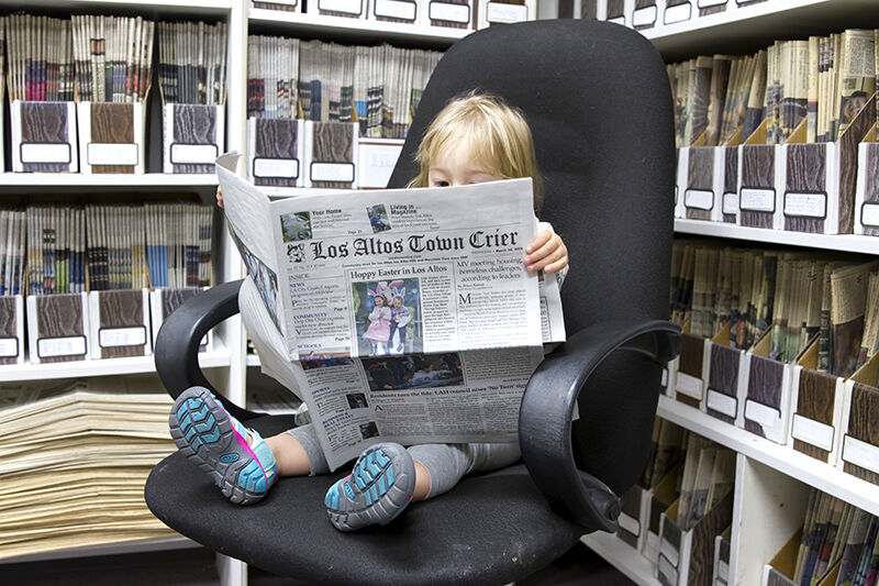 You can read the Town Crier in print, online, or, as pictured above, in the newsroom's