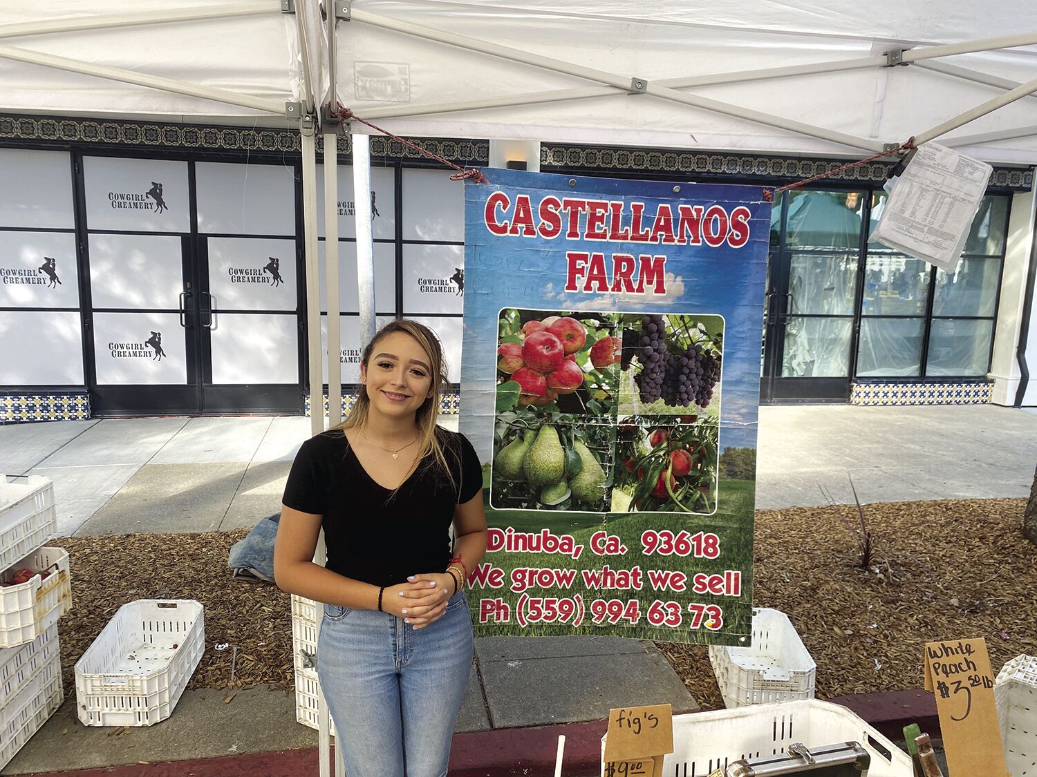 Kimberly Valdez represents Dinuba-based Castellanos Farms at its booth at the Downtown Los Altos Farmers’ Market.