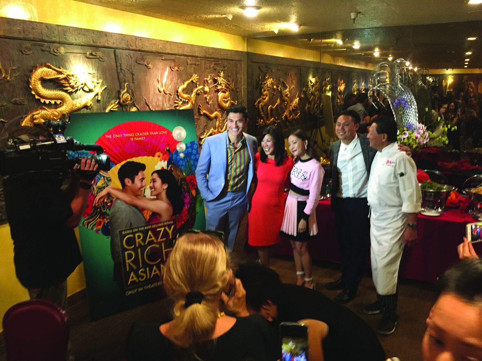 Jon M. Chu, second from right, makes an appearance at Chef Chu’s restaurant following the release of “Crazy Rich Asians” in 2018. Pictured at right is Larry Chu, Sr.
