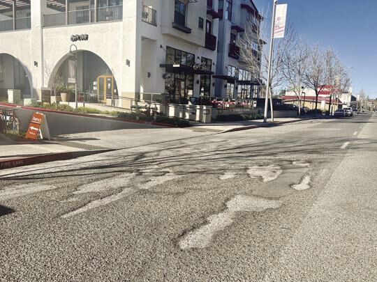 A patchwork of potholes is scattered along El Camino Real.