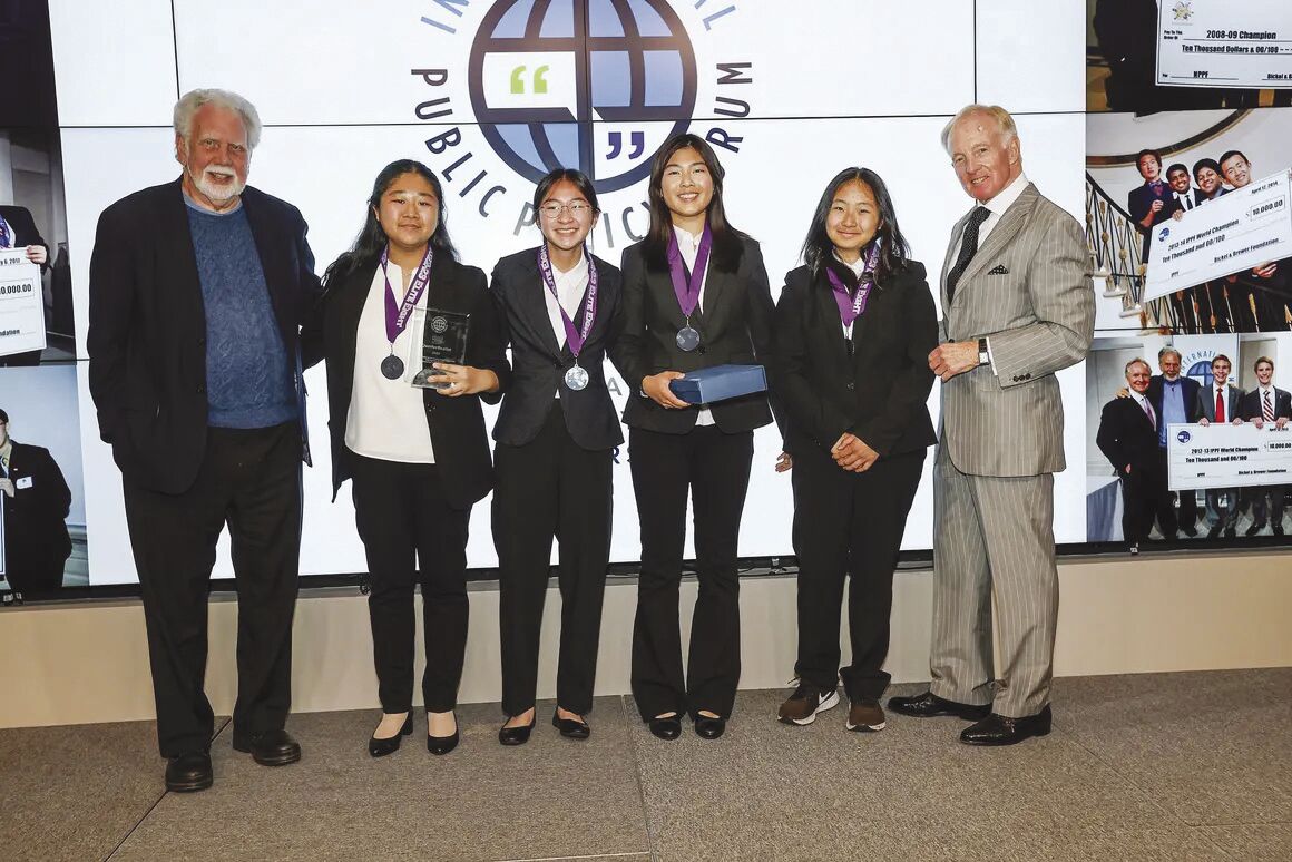 Sophia Yang’s Speech and Debate Team celebrates their performance at the International Public Policy Forum tournament last month.
