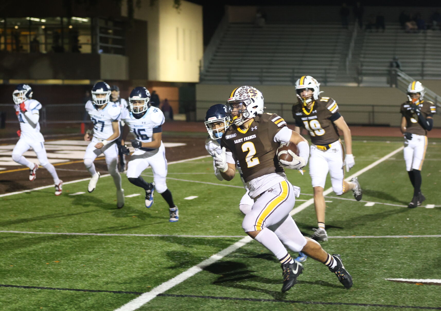 St. Francis running back Kingston Keanaaina scores on a 19-yard touchdown run against Valley Christian in the CCS playoff game Friday.